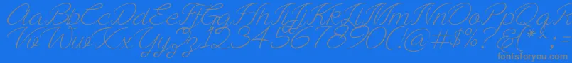 Ayla script Free Demo-fontti – harmaat kirjasimet sinisellä taustalla