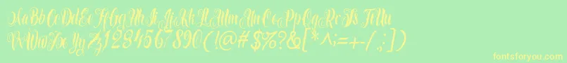 Azkanio Script Font – Yellow Fonts on Green Background