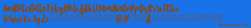Baby Wildy Personal Use-Schriftart – Braune Schriften auf blauem Hintergrund