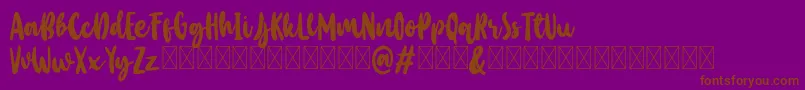 フォントBaby Wildy Personal Use – 紫色の背景に茶色のフォント