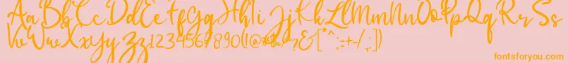 babylittle-Schriftart – Orangefarbene Schriften auf rosa Hintergrund