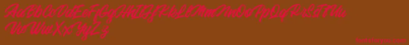 Fonte Backhill Free Version – fontes vermelhas em um fundo marrom