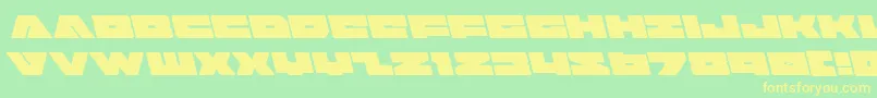 フォントbadaxeleft – 黄色の文字が緑の背景にあります