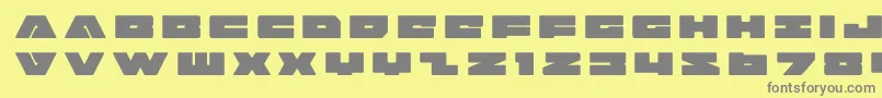フォントbadaxetitle – 黄色の背景に灰色の文字