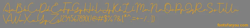 Badriyah Two Font – Orange Fonts on Gray Background