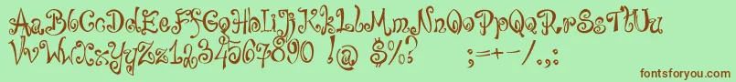 bajareczka-Schriftart – Braune Schriften auf grünem Hintergrund