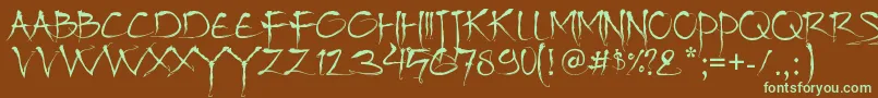 フォントBajhera – 緑色の文字が茶色の背景にあります。