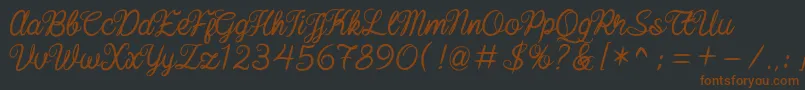 baline script-fontti – ruskeat fontit mustalla taustalla