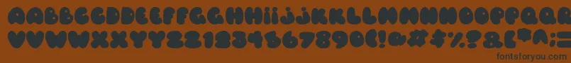 Balloons Italic Font – Black Fonts on Brown Background