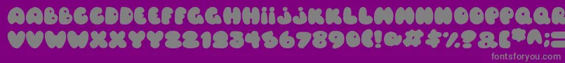 Balloons Italic-fontti – harmaat kirjasimet violetilla taustalla