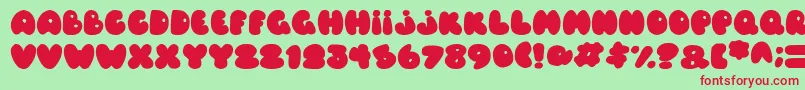 フォントBalloons Italic – 赤い文字の緑の背景