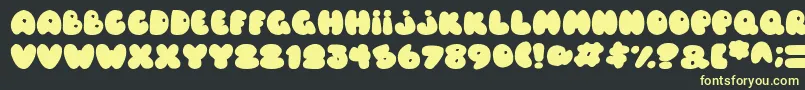 Czcionka Balloons Italic – żółte czcionki na czarnym tle