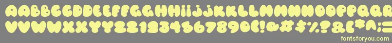 Fonte Balloons Italic – fontes amarelas em um fundo cinza