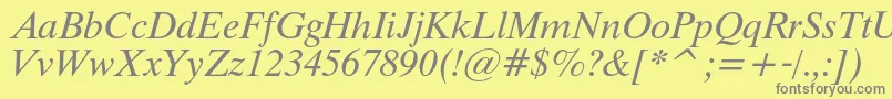 ThamescItalic-fontti – harmaat kirjasimet keltaisella taustalla
