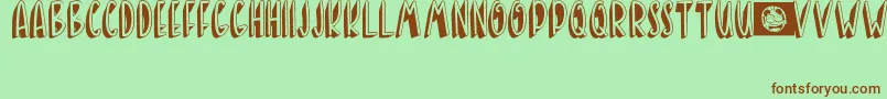 BANDA NEIRA-fontti – ruskeat fontit vihreällä taustalla