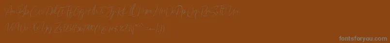 Barosaki Script-Schriftart – Graue Schriften auf braunem Hintergrund