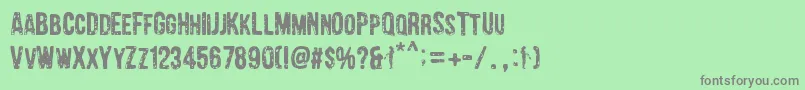 Barrio Chino Font – Gray Fonts on Green Background