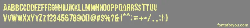 Barrio Chino Font – Yellow Fonts on Gray Background