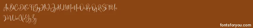 Bashira Free-Schriftart – Weiße Schriften auf braunem Hintergrund