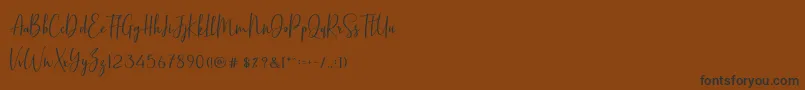BasstonScript Font – Black Fonts on Brown Background