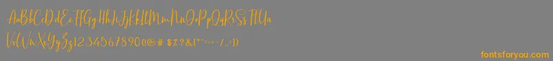 BasstonScript-fontti – oranssit fontit harmaalla taustalla