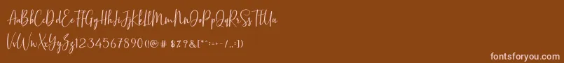 Fonte BasstonScript – fontes rosa em um fundo marrom