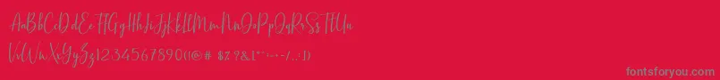 Fonte BasstonScript – fontes cinzas em um fundo vermelho