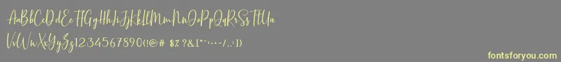 BasstonScript-Schriftart – Gelbe Schriften auf grauem Hintergrund