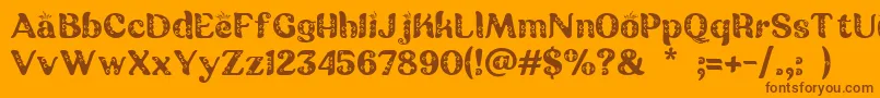 フォントBatik Ganasan – オレンジの背景に茶色のフォント