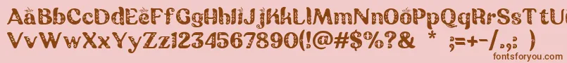 フォントBatik Ganasan – ピンクの背景に茶色のフォント
