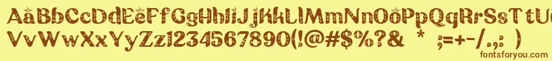 Czcionka Batik Ganasan – brązowe czcionki na żółtym tle