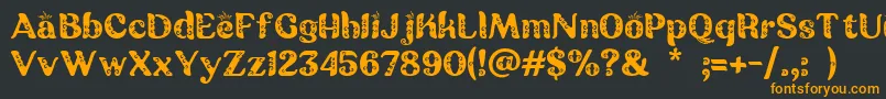 Batik Ganasan Font – Orange Fonts on Black Background