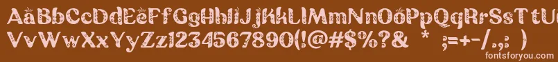 Batik Ganasan Font – Pink Fonts on Brown Background