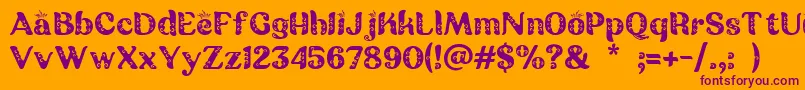 Batik Ganasan-fontti – violetit fontit oranssilla taustalla