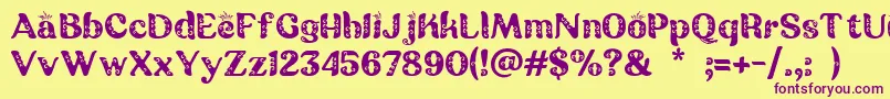 Batik Ganasan-fontti – violetit fontit keltaisella taustalla