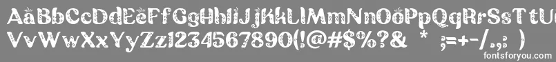 Batik Ganasan-Schriftart – Weiße Schriften auf grauem Hintergrund