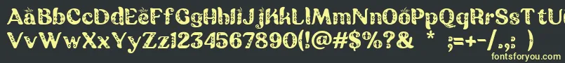 Batik Ganasan Font – Yellow Fonts on Black Background