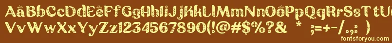 Batik Ganasan Font – Yellow Fonts on Brown Background