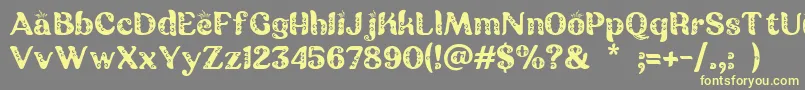 Batik Ganasan Font – Yellow Fonts on Gray Background