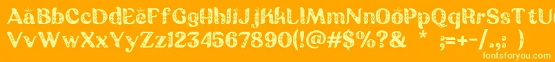 Batik Ganasan-Schriftart – Gelbe Schriften auf orangefarbenem Hintergrund