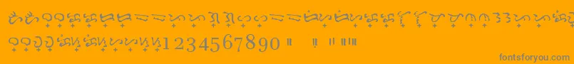 Baybayin Doctrina-fontti – harmaat kirjasimet oranssilla taustalla