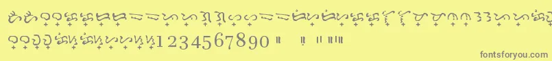 Fonte Baybayin Doctrina – fontes cinzas em um fundo amarelo