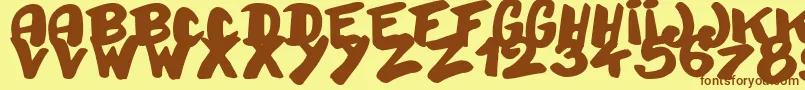 フォントBayday – 茶色の文字が黄色の背景にあります。