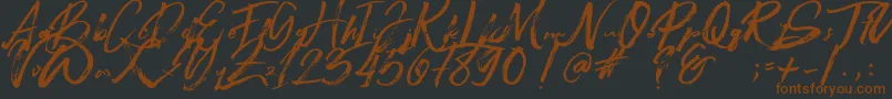 Beastmachine Font – Brown Fonts on Black Background