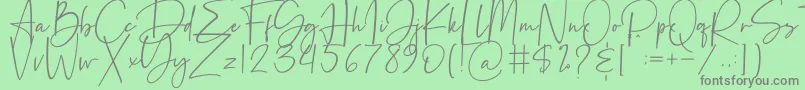 フォントBeatrise – 緑の背景に灰色の文字