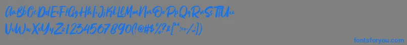 フォントBeattingvile – 灰色の背景に青い文字