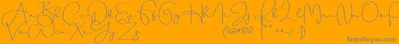 Beauty Dream-Schriftart – Graue Schriften auf orangefarbenem Hintergrund