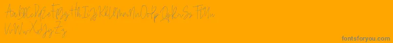 Beauty Signature-Schriftart – Graue Schriften auf orangefarbenem Hintergrund