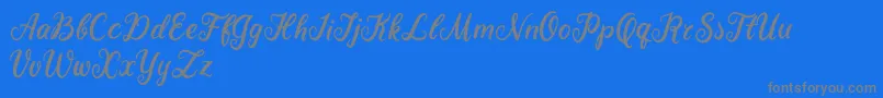 Becky Tahlia-Schriftart – Graue Schriften auf blauem Hintergrund