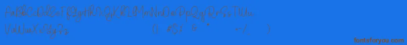 Belandia Font – Brown Fonts on Blue Background